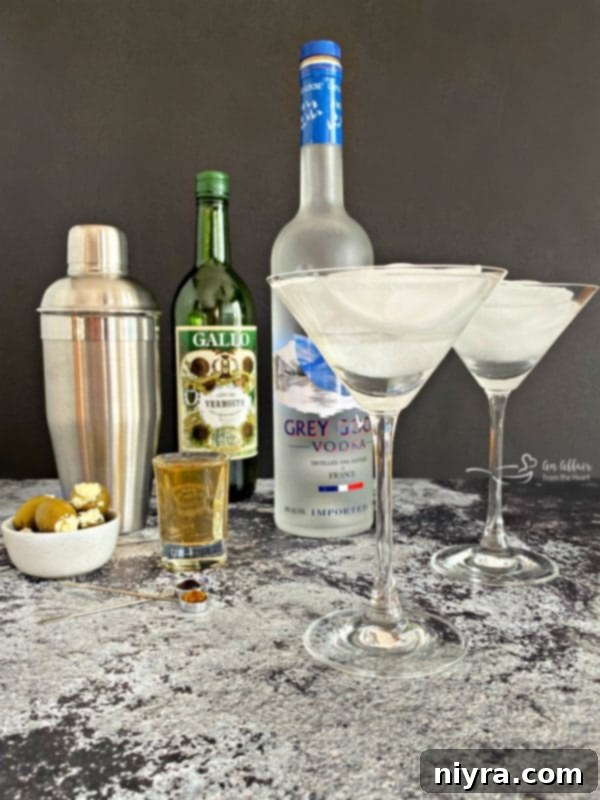 Grey Goose Dirty Martini preparation, showing ingredients and shaker