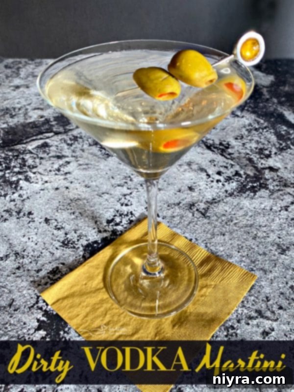 Dirty Vodka Martini with Spanish Olives, garnished with two olives