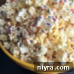 Candy Coated Pop Corn AKA Crack Corn in a yellow bowl