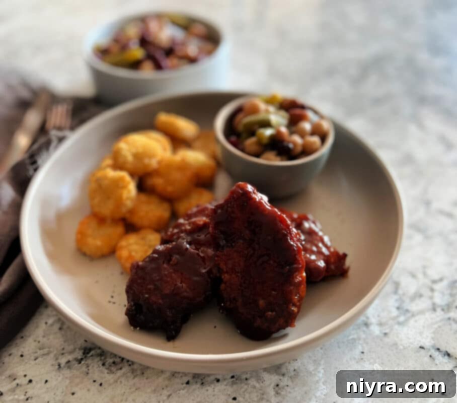 Crispy Air Fryer BBQ Tenders 3 Multiple Air Fryer BBQ Chicken Tenders on a white plate