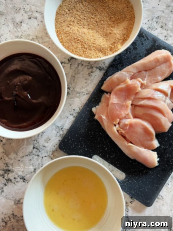 Crispy Air Fryer BBQ Tenders 6 Air Fryer BBQ Chicken Tenders with a side of BBQ sauce