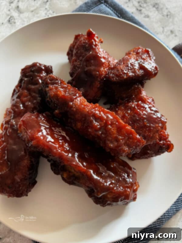 Crispy Air Fryer BBQ Tenders 7 BBQ Chicken Tenders being placed into an air fryer