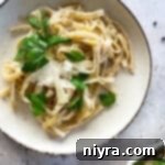 fettuccine alfredo in a white dish
