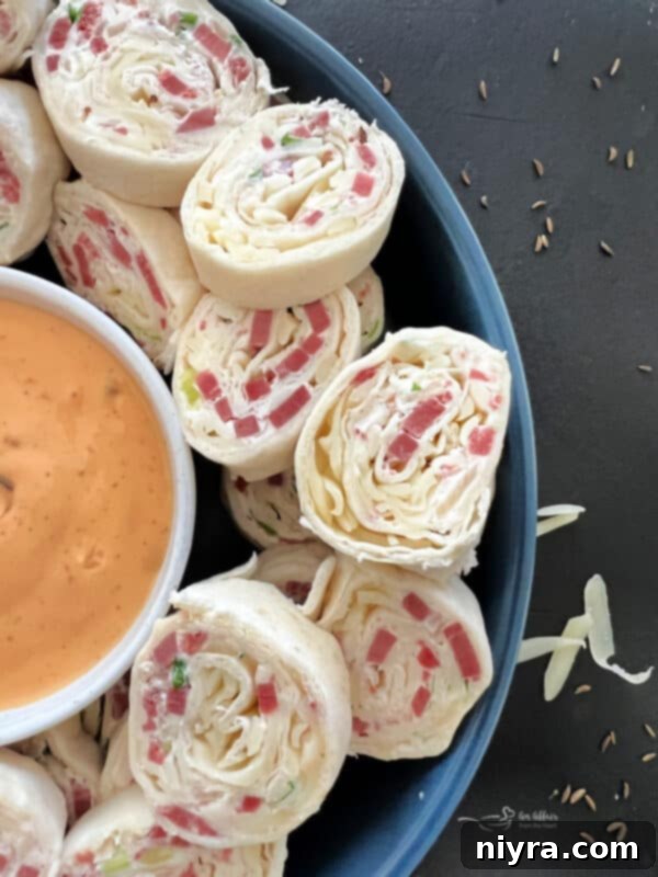Reuben Style Tortilla Roll-Ups served on a platter
