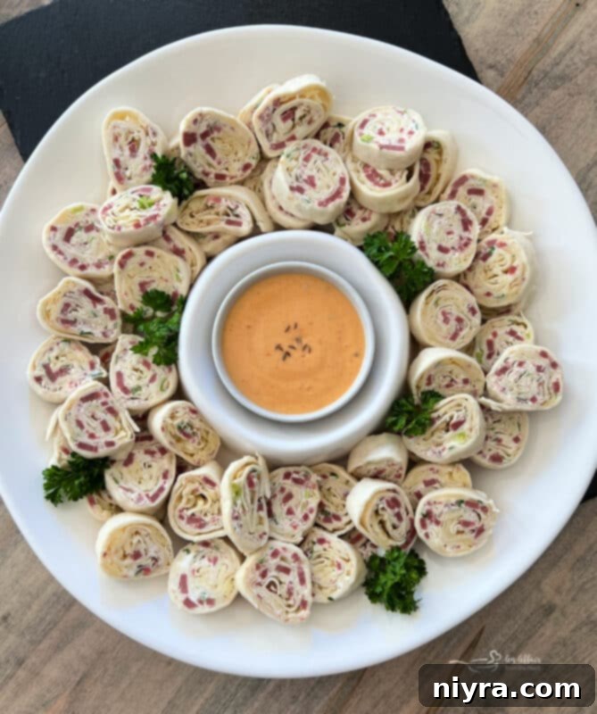 Reuben Style Tortilla Roll-Ups served with Thousand Island dressing for dipping