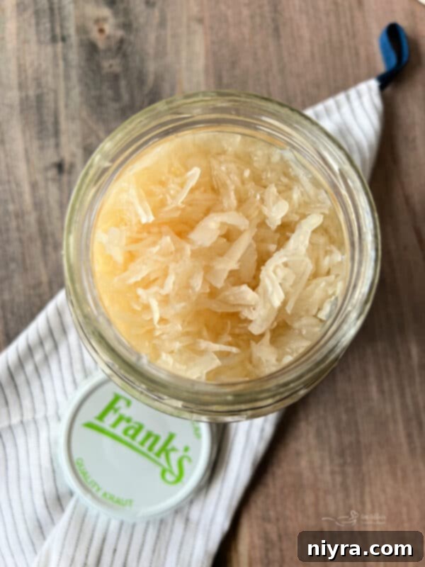 Reuben Style Tortilla Roll-Ups on a platter with dressing