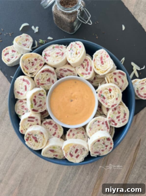 Reuben Style Tortilla Roll-Ups on a platter ready to serve