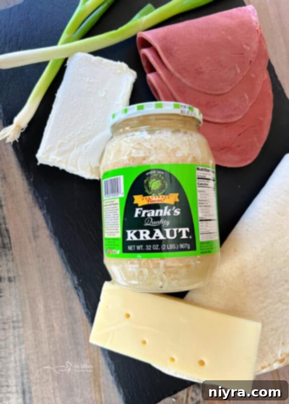 Reuben Style Tortilla Roll-Ups on a cutting board, ready to be sliced