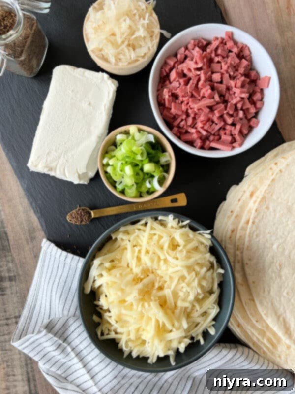 Reuben Style Tortilla Roll-Ups with ingredients in bowls
