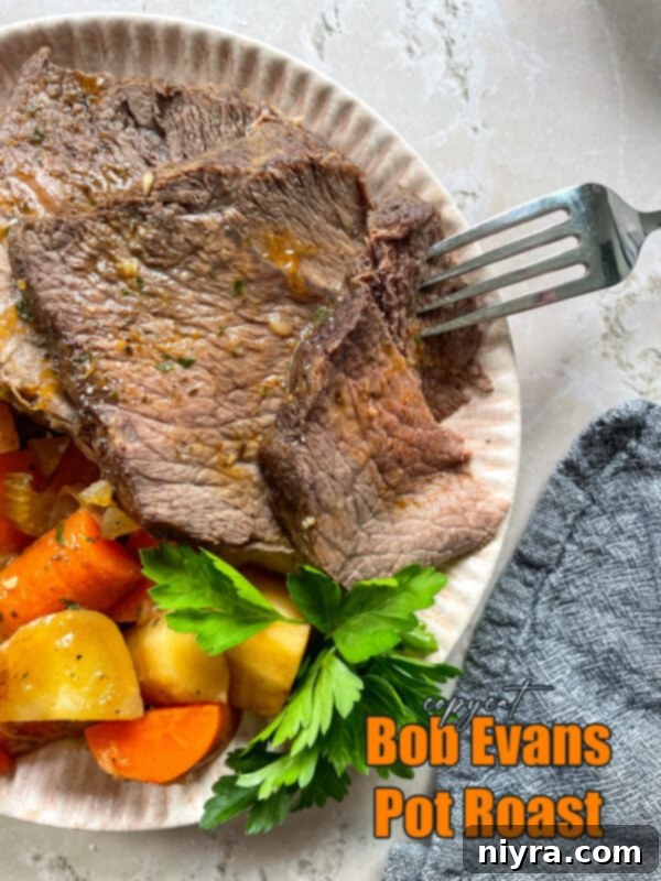 A beautifully presented Bob Evans style pot roast on a serving platter, surrounded by vegetables and rich gravy, highlighting the main dish.
