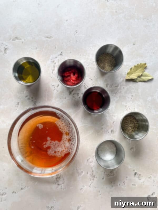 Close-up of cooked chuck roast, cut into large, tender pieces, ready to be served. The texture is moist and the edges show a nice sear.