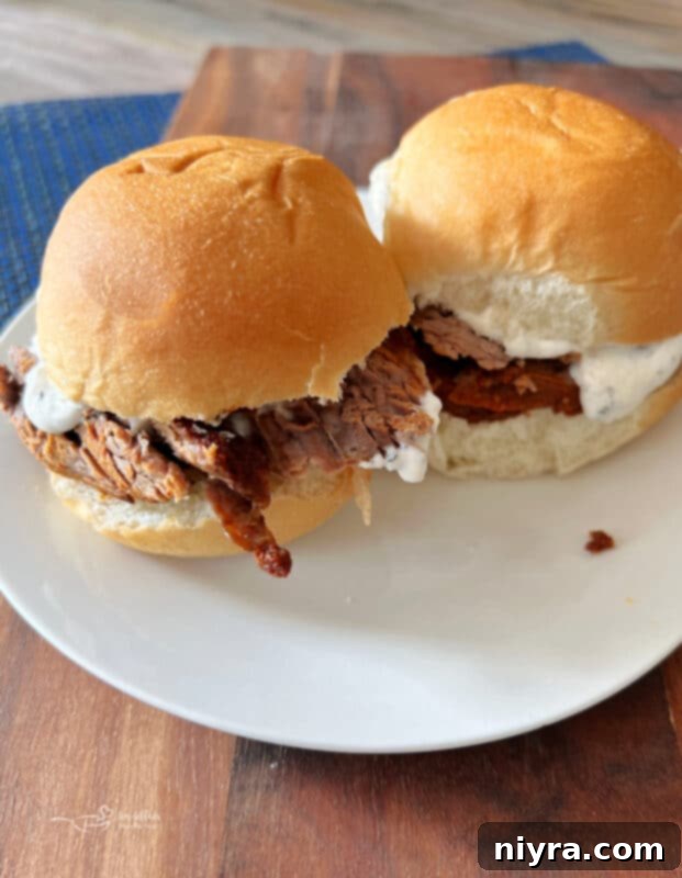 Spicy Smoked Brisket served on slider rolls with homemade horseradish sauce.
