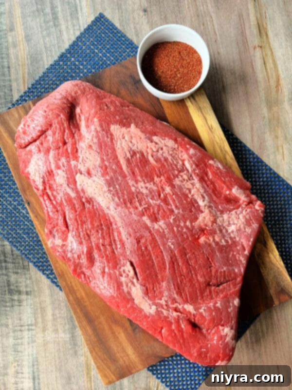 Close-up of a perfectly cooked Spicy Beef Brisket with a beautiful bark.