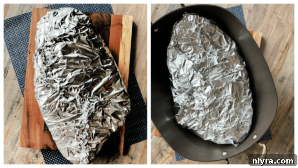 Spicy brisket rub being pressed into the beef brisket.