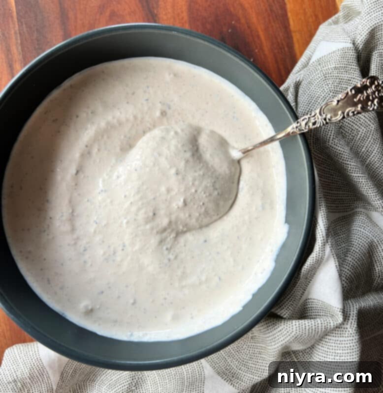 Wrapped brisket ready for cooking in a roaster.