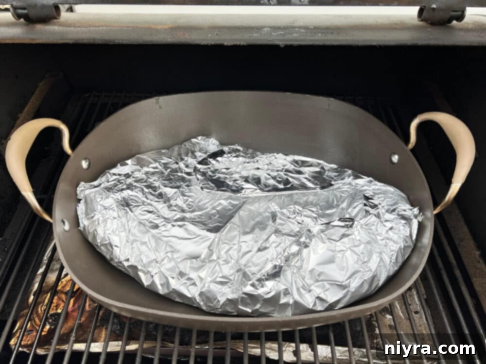 Pellet smoker being prepared with hickory pellets.