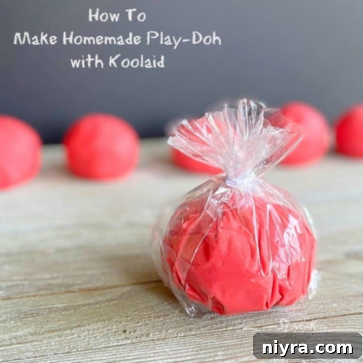 Hero image of vibrant homemade Kool-Aid Play-Doh, ready for play.