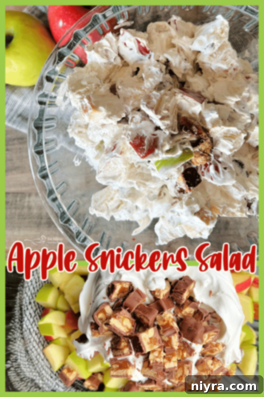 A close-up side view of the finished Snicker Apple Salad, showing layers of ingredients.