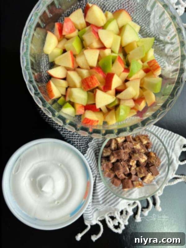 Another view of the Snicker Apple Salad in a large serving bowl, highlighting the combination of ingredients.