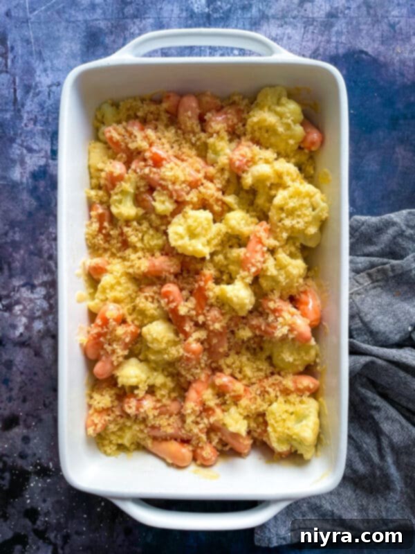 Melted butter being mixed with panko breadcrumbs for the topping.