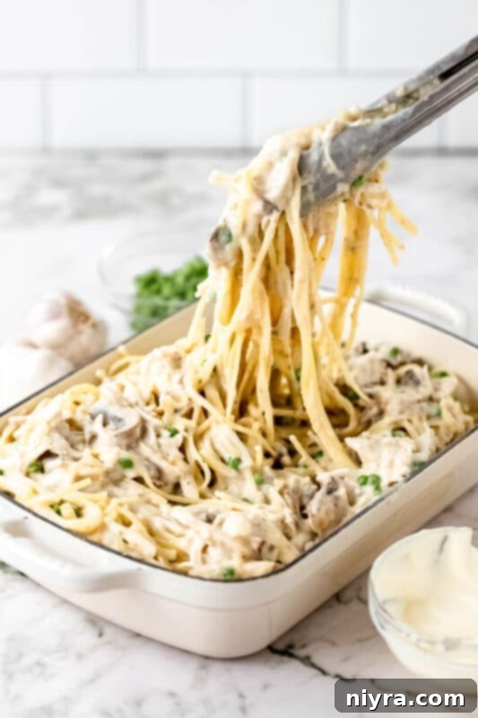 Frozen peas being added to the turkey pasta mixture.