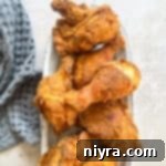 KFC copycat Fried chicken in a white serving dish.