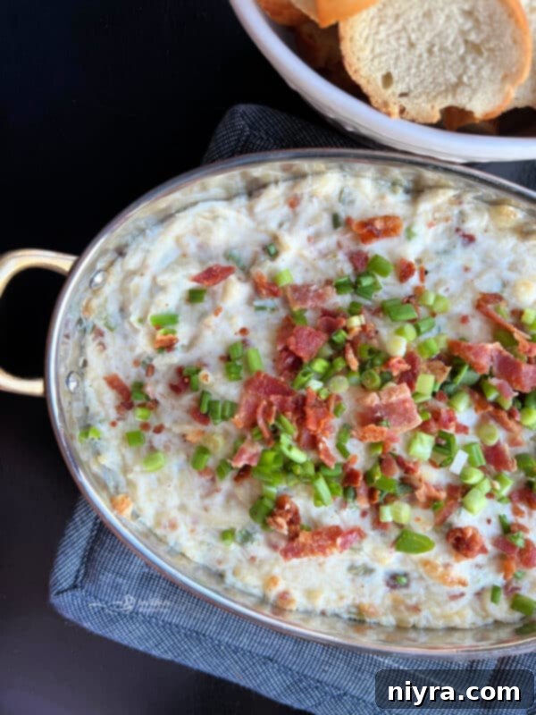 Savory Sauerkraut, Bacon and Swiss Dip 3 Close-up of the Sauerkraut Bacon Swiss Dip, showing its creamy texture and bacon bits.