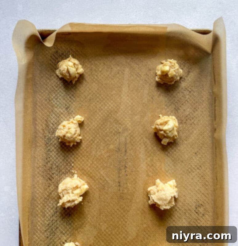 Warm Banana Bliss Bites 9 Chopped bananas being folded into fritter batter.