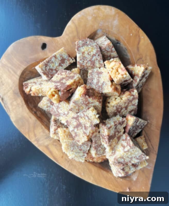 A close-up of Scotcheroo Pinwheels on a white plate, showing their texture.