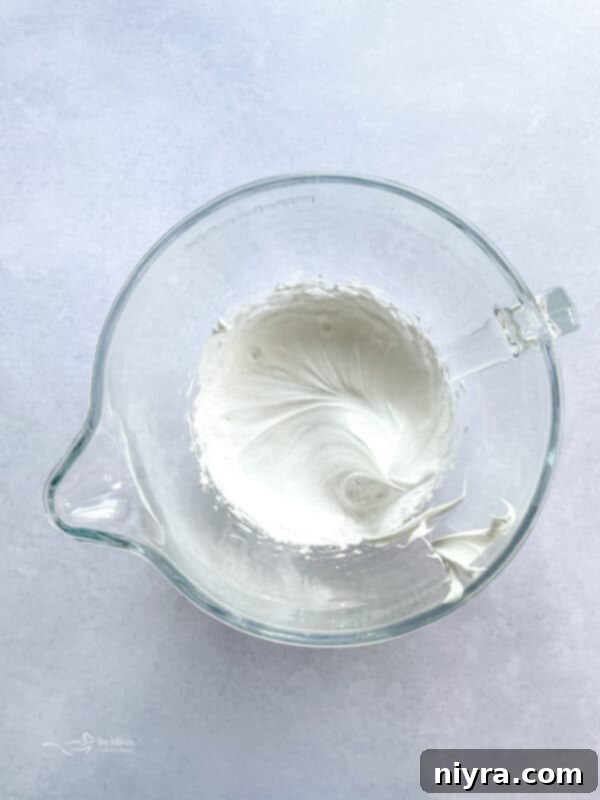 Minty Dream Clouds 5 Egg whites, salt, and cream of tartar in a mixing bowl before whipping for meringues.