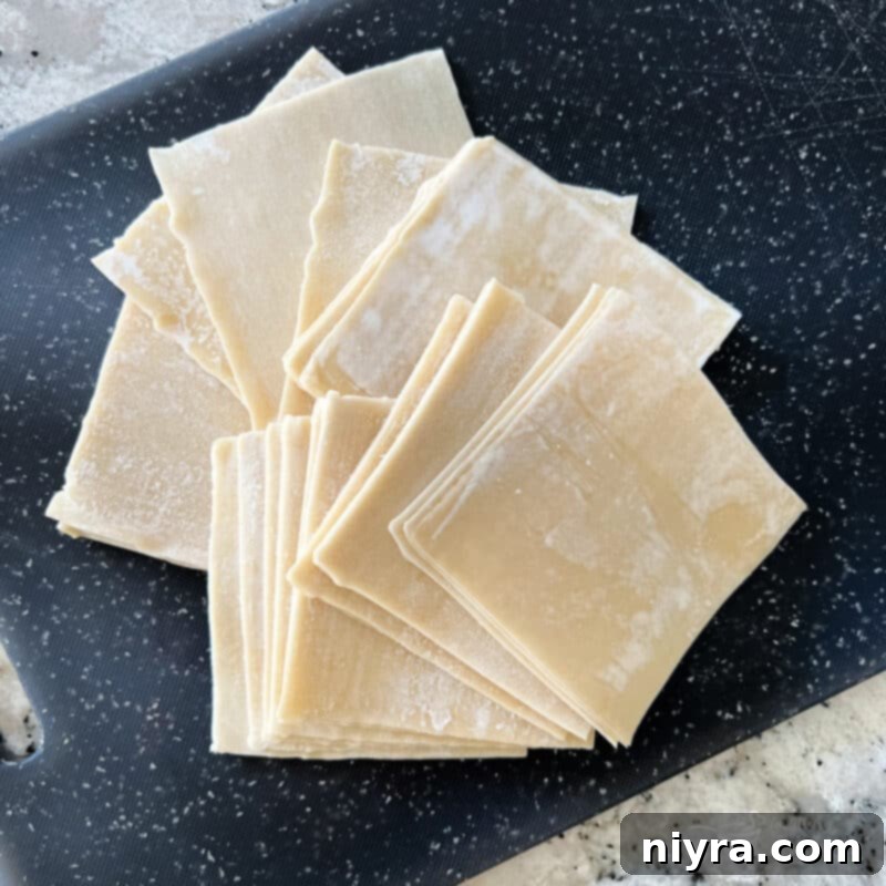 A bowl of fresh, homemade air fryer wonton chips, perfectly golden brown and ready for dipping.