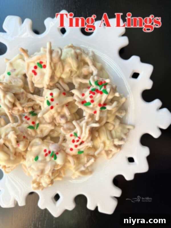 A beautiful display of White Ting A Lings on a white tray, adorned with a festive sprig.