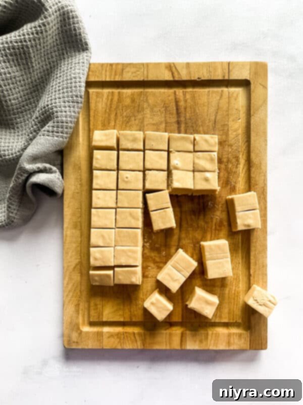 Freshly cut peanut butter fudge on a wire cooling rack