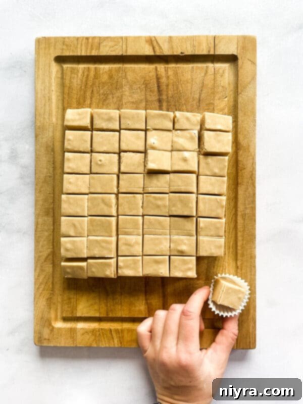 Ingredients for peanut butter fudge laid out on a wooden cutting board
