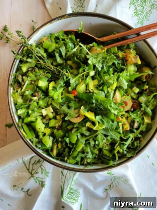 Bright Mediterranean Celery Olive Salad 4 Overhead shot of the finished Mediterranean Celery Salad, served in a large wooden bowl, ready to be enjoyed.