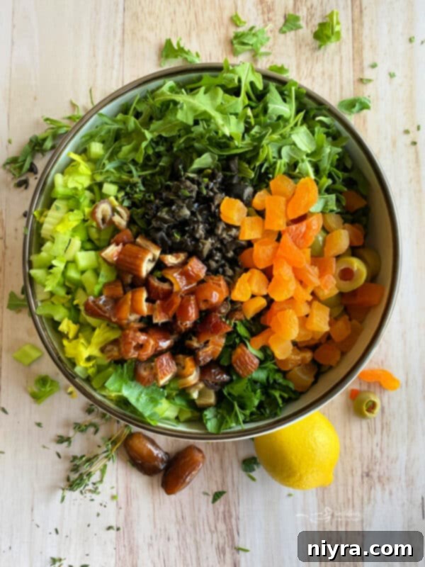 Bright Mediterranean Celery Olive Salad 9 Step 2: A large bowl containing the fresh arugula, parsley, thyme, and sliced celery.