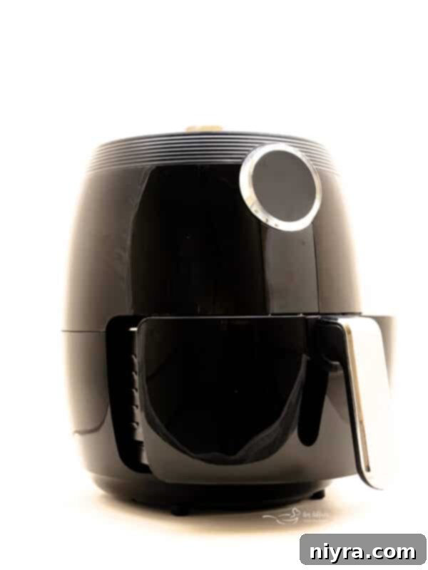 Air Fryer Quick Guide Free Printable 9 Front cover of the free printable air fryer cheat sheet, highlighting its utility.