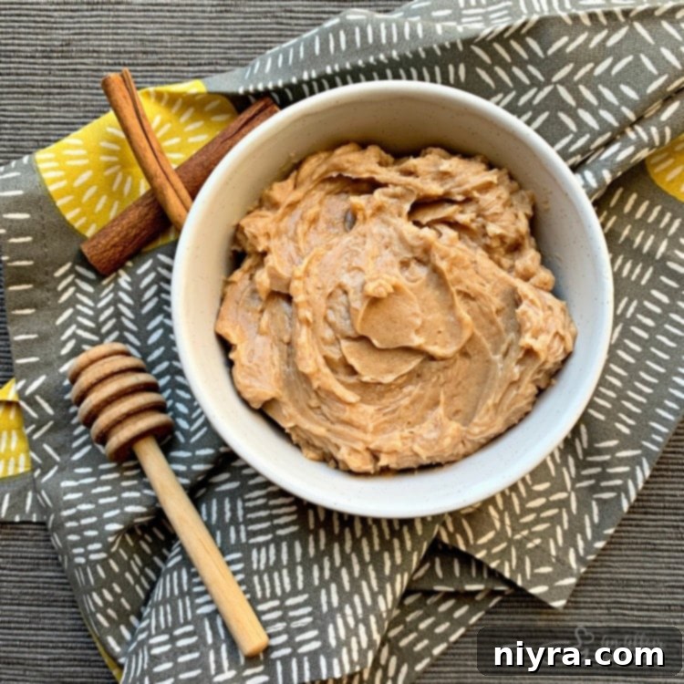 Crimson Cherry Whip 11 Overhead of Copycat Texas Roadhouse Cinnamon Honey Butter in a white serving bowl.
