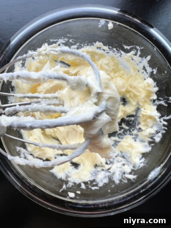 Crimson Cherry Whip 6 Step 1: Beating softened butter in a bowl until fluffy.