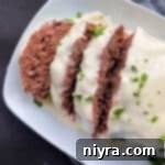 Reuben Meatloaf with Corned Beef and a Swiss Cheese Sauce