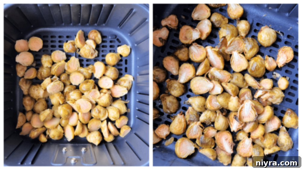 Brussels sprouts in an air fryer basket, drizzled with sesame oil