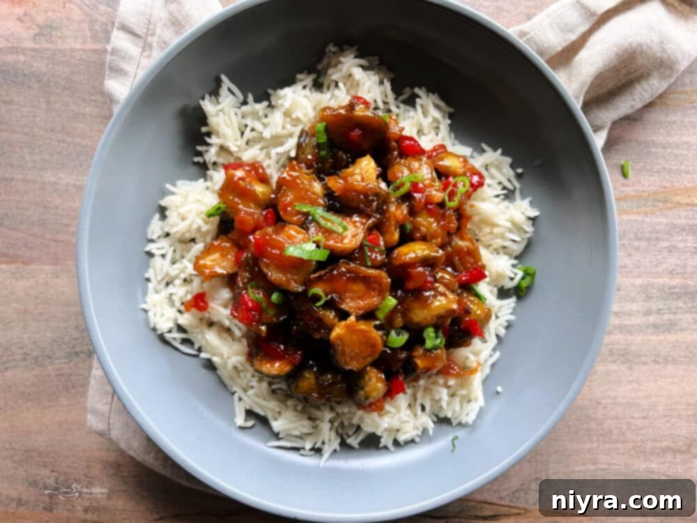 Sweet and Sour Brussels Sprouts plated with green onions