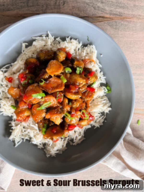 Sweet and Sour Brussels Sprouts in a serving bowl, garnished