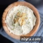 Savory Chicken Cracker Dip 12 Chicken in a Biskit dip in a wood bowl.