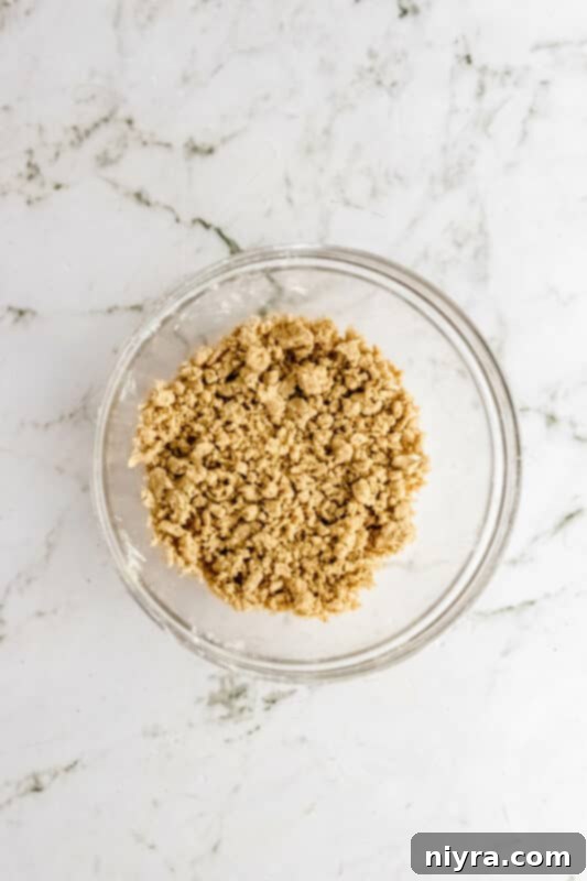 Crumb-Topped French Toast Casserole 9 Mixing streusel topping ingredients in a bowl