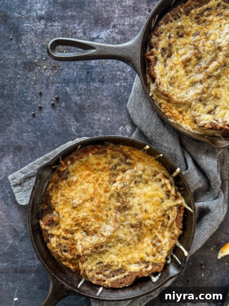 A bowl of French Onion Soup with a perfect cheese pull