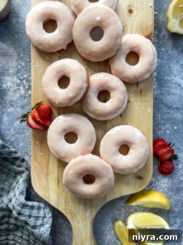 Close-up of baked strawberry lemonade donuts with a sweet glaze.