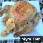 Chicken on a white serving platter with text "lemon mayonnaise chicken"