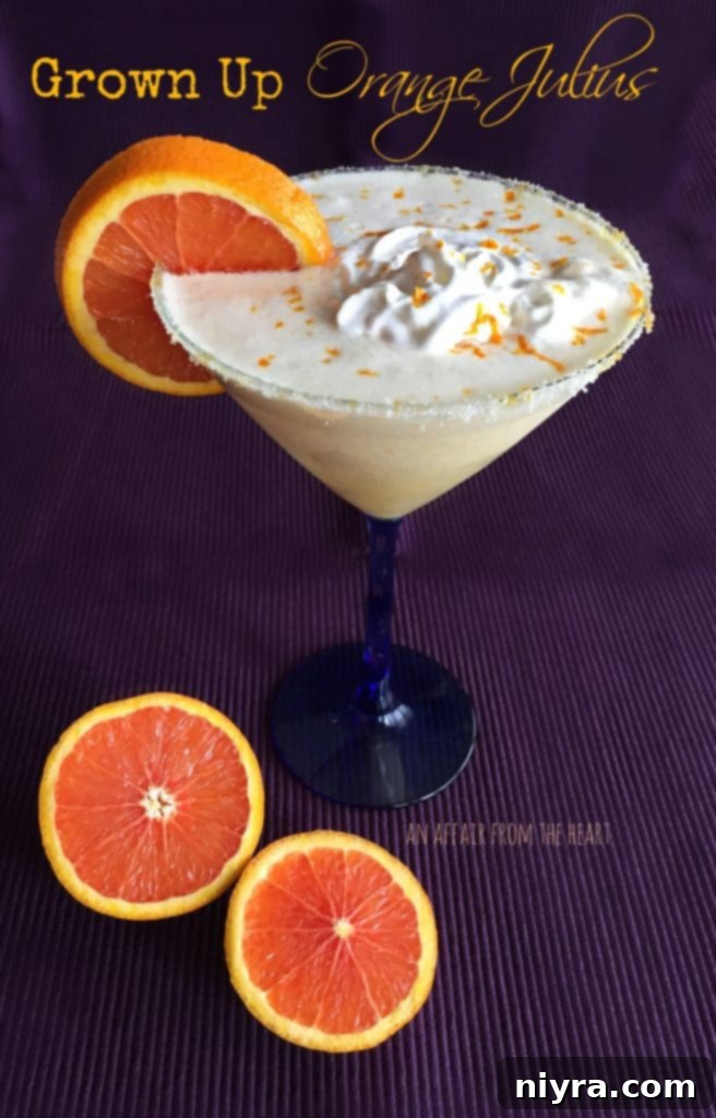A Grown-Up Orange Julius cocktail served in a casual pint glass over ice.
