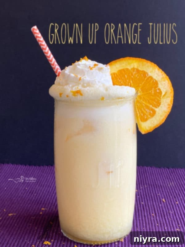 A final close-up image of the Grown-Up Orange Julius cocktail, showcasing its frothy texture and inviting color.